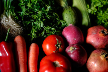 red and green fresh vegetables fruits on blue wood