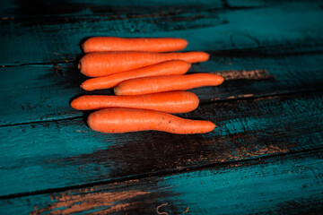 carrots on blue table top view