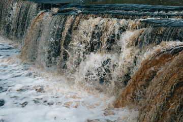 A stormy river with a brown hue.