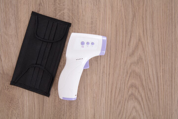 Infrared thermometer and mask