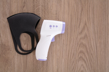 Infrared thermometer and mask