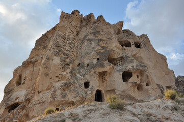 Exterior view of Uchisar Castle in Cappadocia, Turkey near sunset
