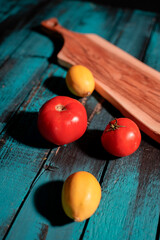 lemon and tomato on wooden table