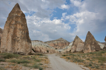 Scenic landscape view of a trail winding through the surreal landscape of Cappadocia, Turkey, on a...