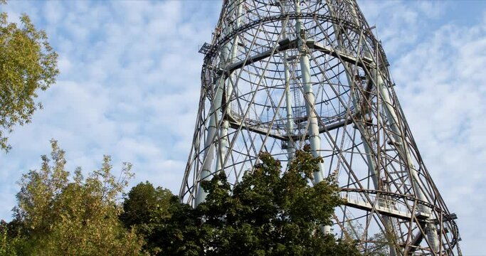 Shuhovskaya TV tower under running clouds on dioganal track clouds timelapse