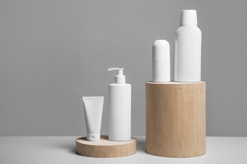 Empty white bottle design on wooden mock up front back profile, front view. Stand for packaging clear cream. Lotion skin care package template. Scincare cosmetic concept.