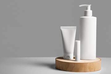 Blank templates of empty and clean white plastic container. cosmetic blank packaging standing on wooden background. Cream, balm and milk