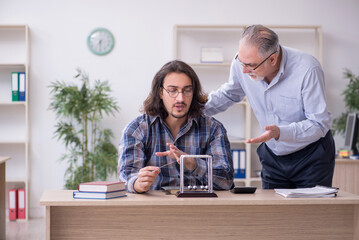 Two employees and meditation balls in the office