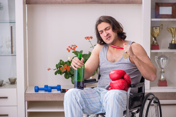 Male ex-champion boxer in wheel-chair suffering from alcoholism