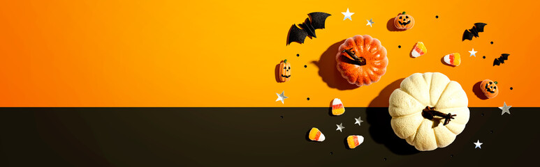 Pumpkins with Halloween decorations - overhead view flat lay