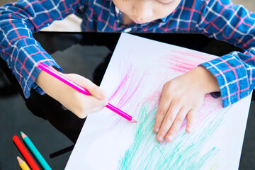 Child learning to colored while doing stay at home