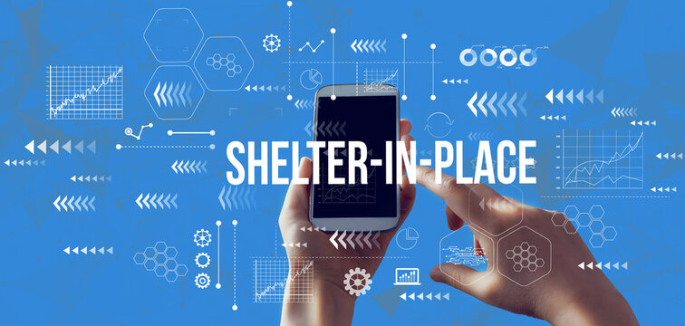 Shelter In Place Coronavirus Theme With Person Holding A White Smartphone