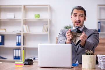 Young male employee working in the office