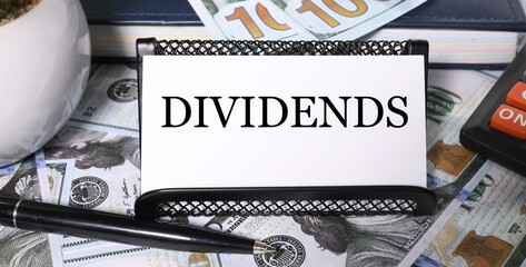 dividends, text on white paper with dereg background