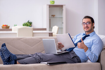 Tired businessman employee working from home