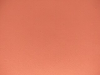 The cement wall painted orange color