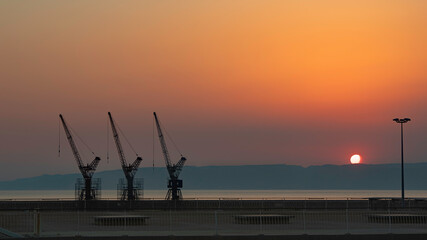 The cranes of the port of Marseille at sunset - Marseille - France - June 2019