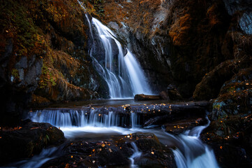 Fototapeta na wymiar Chodor waterfall, on lake Teletskoye in autumn, Russia, Altai