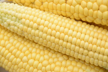 kidneys of raw corn lie on a dark wooden background