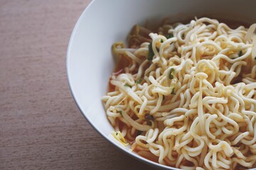 dry tomyum noodle on wooden table