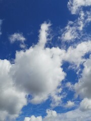 White clouds are floating in the blue sky.