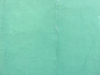 緑に塗ったコンクリートの壁のテクスチャ