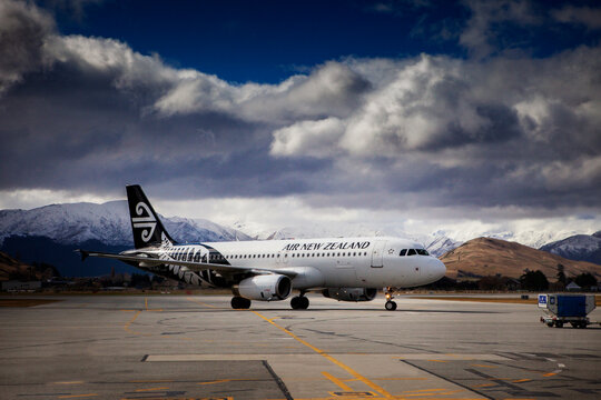 QUEENSTOWN NEW ZEALAND - SEPTEMBER 6,2015 : air new zealand plane approach on runway before boarding