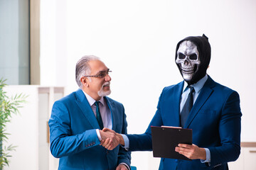 Old businessman employee getting deal with the devil