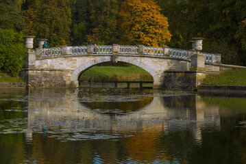 Fototapeta premium Old Viscontiev Bridge close up on September afternoon. Pavlovsk Park