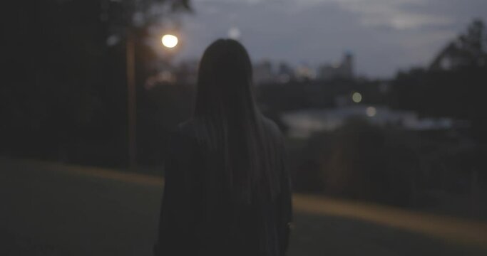 Walking on hill with city behind