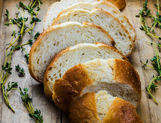 white bread with thyme on wooden texture