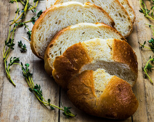 cut white bread on wooden background