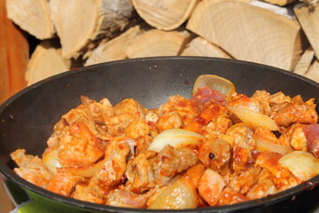 goulash with carrots and onions in a pan