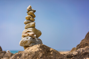 Fototapeta na wymiar Balanced stones on the beach