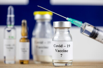 Finland Flag and bottle with vaccine and syringe, Coronavirus, Covid-19, Medicine, science and healthcare concept