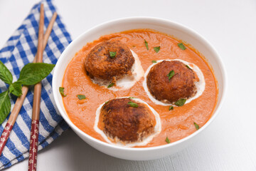 Malai Kofta Curry Mughlai or Haryanvi style Methi  in white cream, popular indian vegetarian main course served with Chapati Or Roti. Cheese ball dipped in creamy gravy Classic North Indian side dish