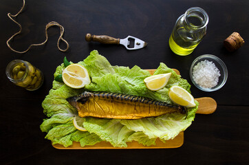 smoked mackerel fish on dark background