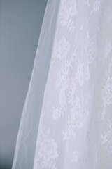 Close up of lace details on a wedding dress or veil.