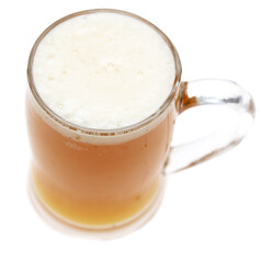 Mug of foamy beer isolated on white background.
