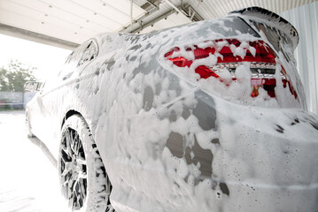 Car wash with soap.Car getting a wash with soap, car washing.
