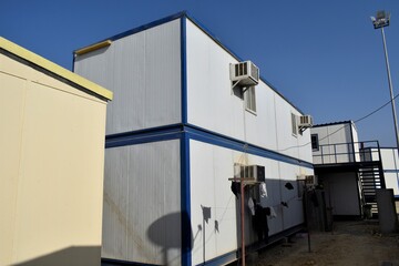 Portacabin, porta cabin, temporary labors camp , Mobile building in industrial site or office container Portable house and office cabins. Labor Camp. Porta cabin. small temporary houses