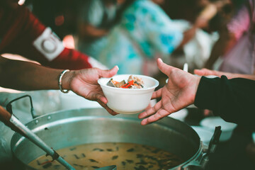 Feeding the poor to hands of a beggar : feeding food for beggar poverty concept