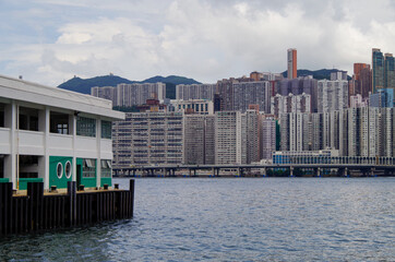 Boat and ship traffic in bay of Victoria Harbor Hong Kong, China with city skyline in background...