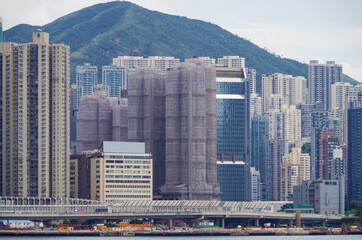 Boat and ship traffic in bay of Victoria Harbor Hong Kong, China with city skyline in background...