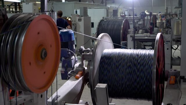 an electrical cable in isolation is wound on a metal coil