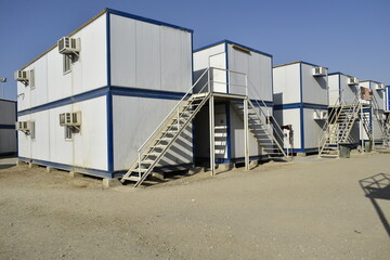 Portacabin, porta cabin, temporary labors camp , Mobile building in industrial site or office container Portable house and office cabins. Labor Camp. Porta cabin. small temporary houses