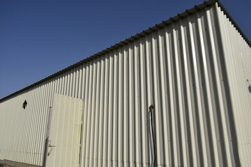 Industrial warehouse construction and interior and outdoor view of the roof ceiling structure. 