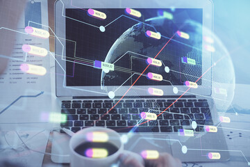 Multi exposure of table with computer and world map hologram. International data network concept.