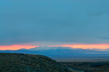 panoramic view of picturesque snowy mountains tops on blue sky background