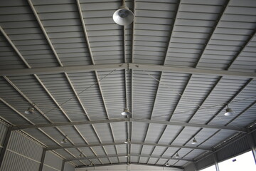 Industrial warehouse construction and interior and outdoor view of the roof ceiling structure. 
